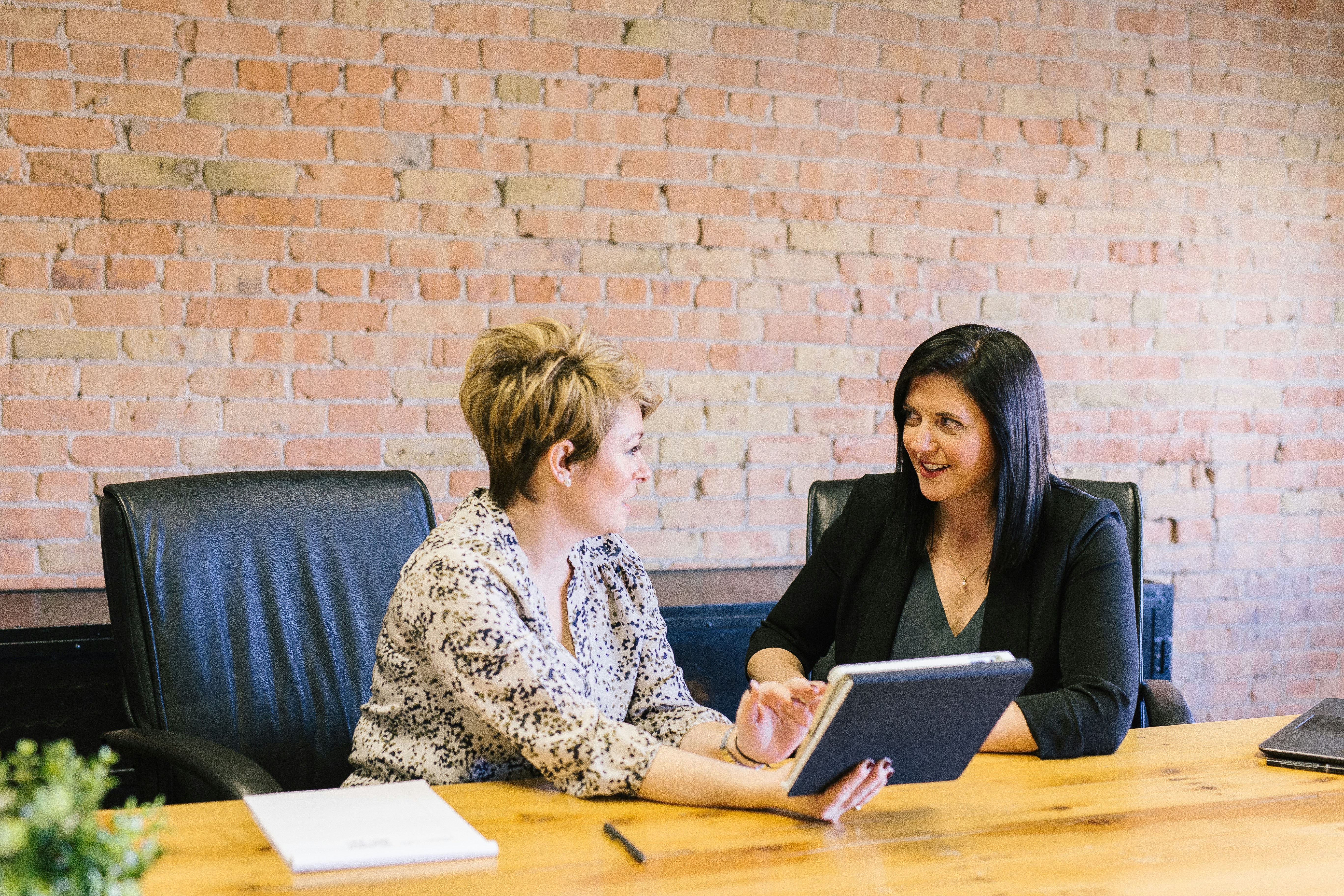 Business professionals in a meeting discussing lead generation strategies